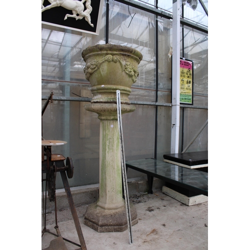 1518 - A LARGE RECONSTITUTED STONE PLANTER ON COLUMN PEDESTAL BASE (H:132CM)