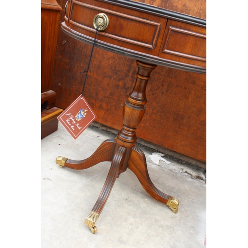 A MAHOGANY AND CROSSBANDED DRUM TABLE BY J. SYDNEY-SMITH ENCLOSING TWO ...