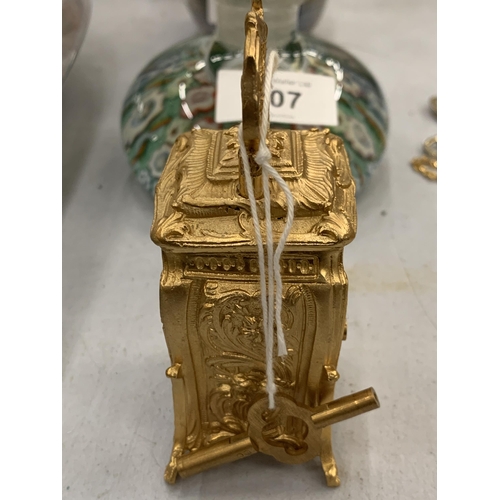 108 - A MINIATURE GILDED FRENCH CLOCK WITH KEY HEIGHT 3.5