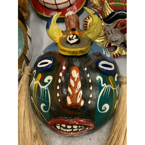 117 - A COLLECTION OF TRIBAL MASKS