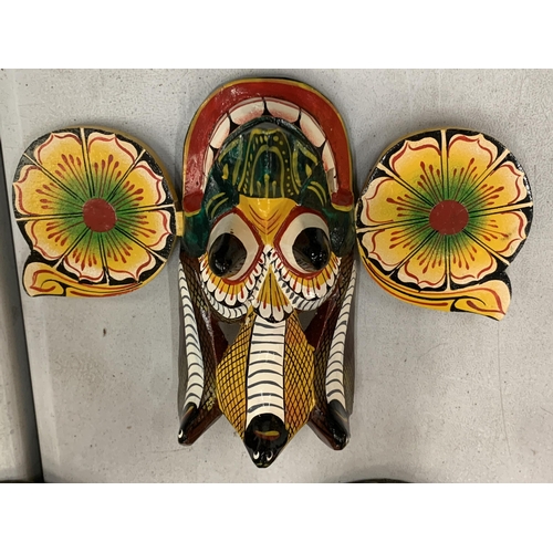 117 - A COLLECTION OF TRIBAL MASKS