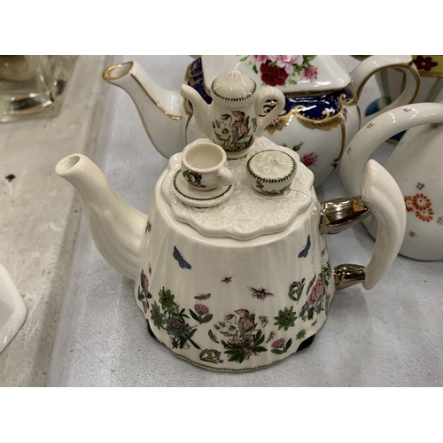 121 - A LARGE QUANTITY OF MINIATURE TEAPOTS TO INCLUDE PORTMERION, BEATRIX POTTER, THE LEONARDO COLLECTION... 