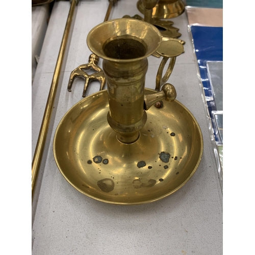 131 - A COLLECTION OF BRASS ITEMS TO INCLUDE KETTLES, BELLS, CANDLESTICKS, ETC.,