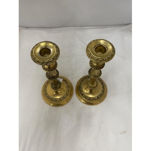 142 - TWO LARGE BRASS CANDLESTICKS 27 CM