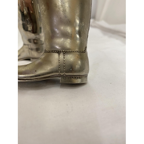 145 - A PAIR OF SILVER PLATED BOOT SALTS WITH INNERS