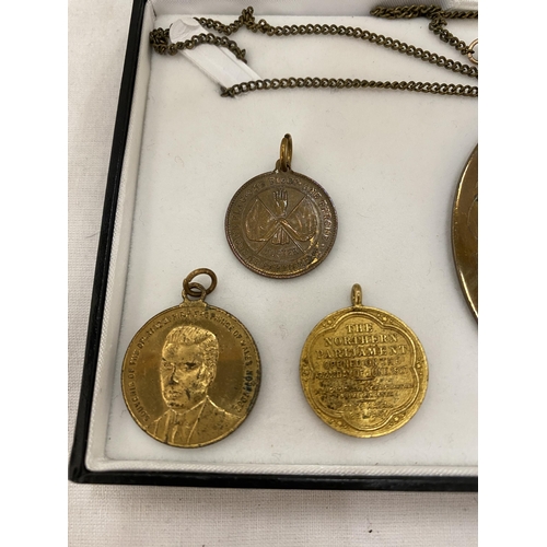 153 - A BOX CONTAINING FOUR IRISH UNIONIST PENDANTS