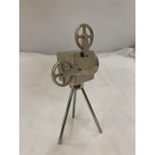 155 - A WHITE METAL MODEL OF A PROJECTOR, HEIGHT 13CM