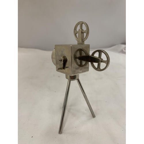 155 - A WHITE METAL MODEL OF A PROJECTOR, HEIGHT 13CM