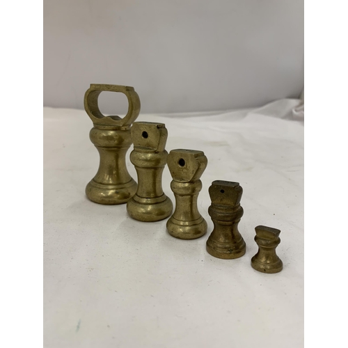 157 - A SET OF 5 BRASS WEIGHTS