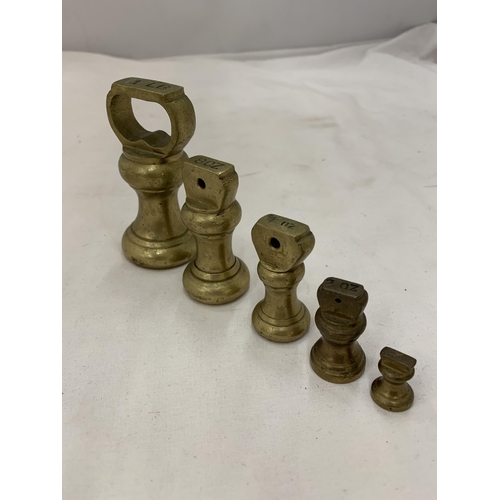 157 - A SET OF 5 BRASS WEIGHTS