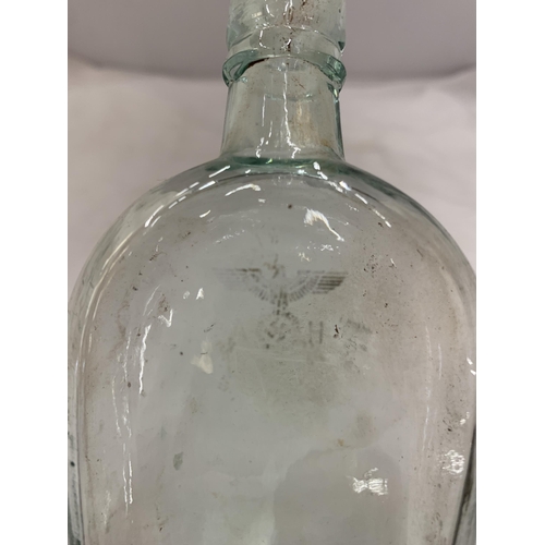 172 - A VINTAGE GERMAN BOTTLE WITH A GOLD SWASTIKA