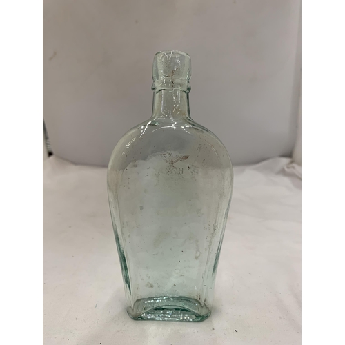 172 - A VINTAGE GERMAN BOTTLE WITH A GOLD SWASTIKA