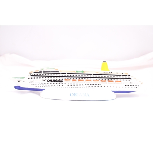 188 - A HEAVY, SOLID, OCEAN LINER ON A STAND, 'ORIANA', LENGTH 30CM, HEIGHT 6CM