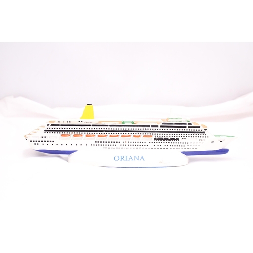 188 - A HEAVY, SOLID, OCEAN LINER ON A STAND, 'ORIANA', LENGTH 30CM, HEIGHT 6CM