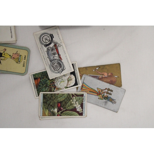 202 - A VINTAGE CIGARETTE TIN CONTAINING CIGARETTE CARDS