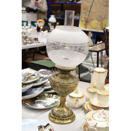 206 - A VINTAGE BRASS OIL LAMP WITH ENGRAVING, A FUNNEL AND ROUND ETCHED GLASS SHADE, HEIGHT APPROX 53CM