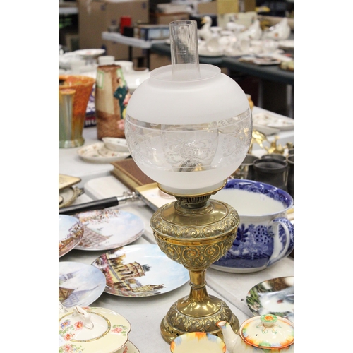 206 - A VINTAGE BRASS OIL LAMP WITH ENGRAVING, A FUNNEL AND ROUND ETCHED GLASS SHADE, HEIGHT APPROX 53CM