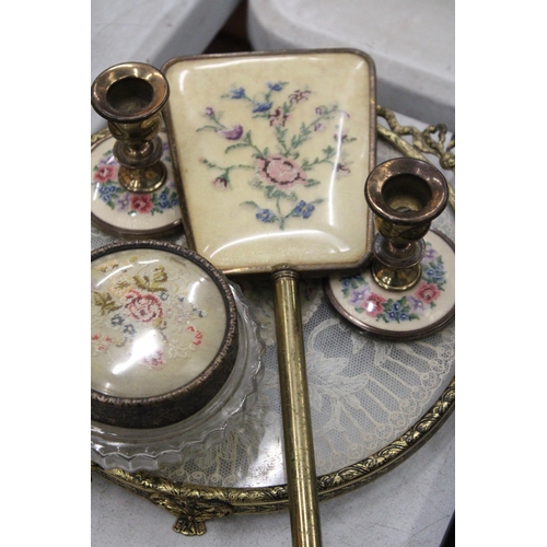 212 - A VINTAGE 'PETIT-POINT' DRESSING TABLE SET TO INCLUDE, CANDLESTICKS, A HAND MIRROR, LIDDED TRINKET J... 