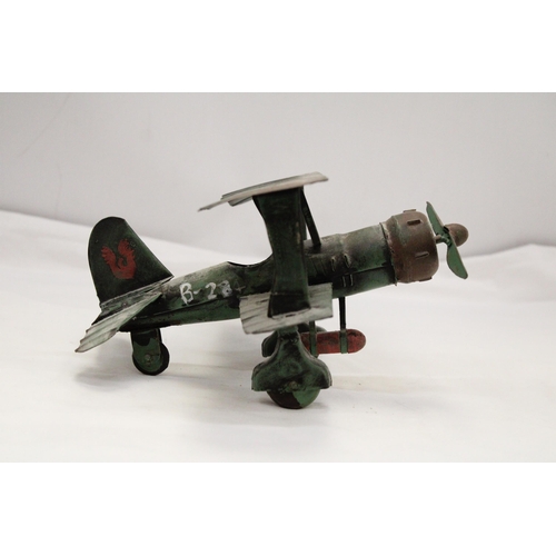 223 - A U.S.A TIN PLATE BI-PLANE APPROXIMATELY 13CM HIGH BY 23CM LONG