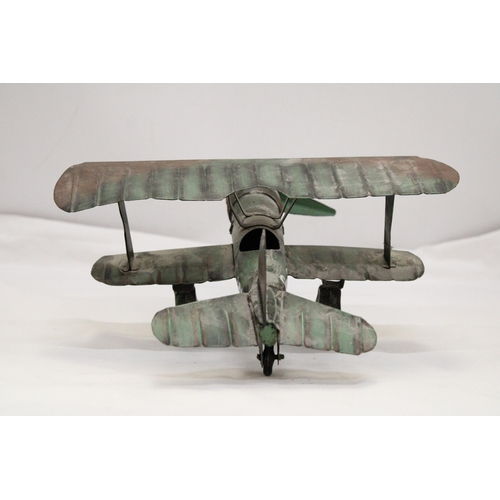 223 - A U.S.A TIN PLATE BI-PLANE APPROXIMATELY 13CM HIGH BY 23CM LONG