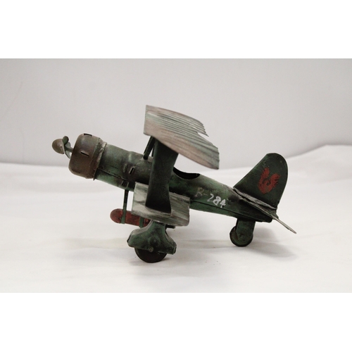 223 - A U.S.A TIN PLATE BI-PLANE APPROXIMATELY 13CM HIGH BY 23CM LONG