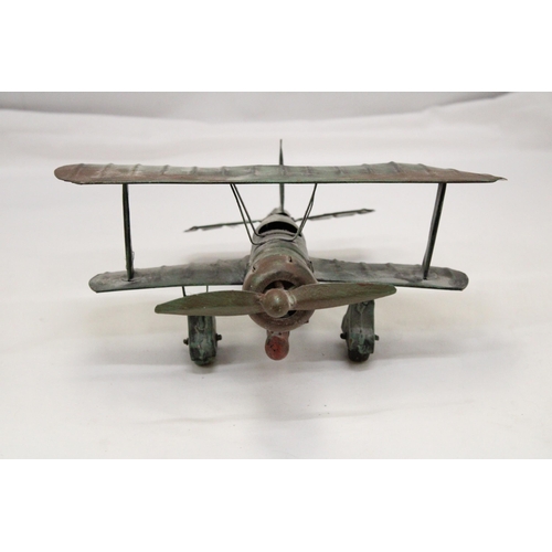 223 - A U.S.A TIN PLATE BI-PLANE APPROXIMATELY 13CM HIGH BY 23CM LONG