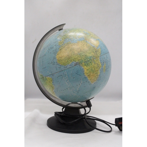 250 - A ROTATING ILLUMINATED GLOBE - APPROXIMATELY 32CM HIGH