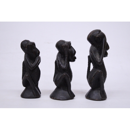 395 - A SET OF THREE TRIBAL MONKEY FIGURES, HEAR NO EVIL, SPEAK NO EVIL AND HEAR NO EVIL