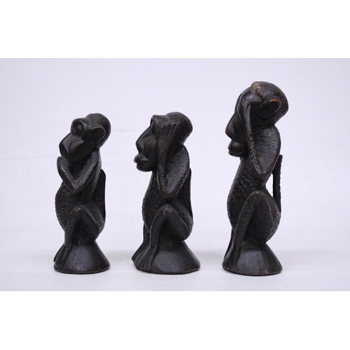 395 - A SET OF THREE TRIBAL MONKEY FIGURES, HEAR NO EVIL, SPEAK NO EVIL AND HEAR NO EVIL