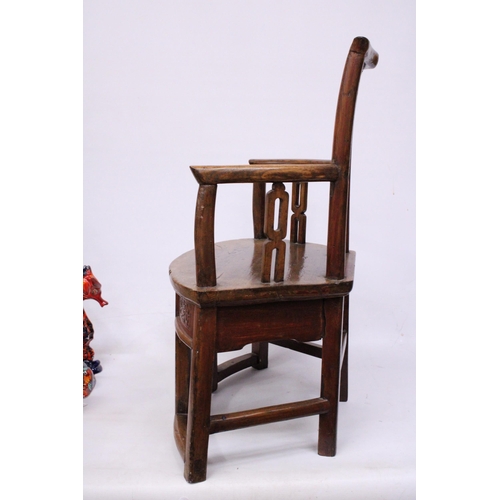 397 - A CHINESE ELM CARVED CHILDS CHAIR