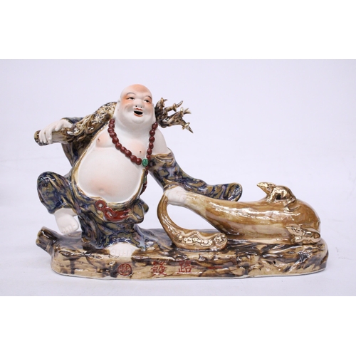 398 - A CHINESE PORCELAIN BUDDHA PULLING A SACK WITH RATS