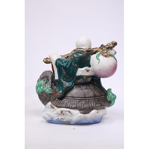 400 - A CHINESE PORCELAIN WISE MAN RIDING A DRAGON TURTLE