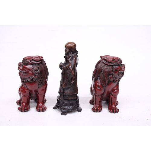 417 - A PAIR OF CHINESE FOO DOGS AND A CHINESE WISEMAN