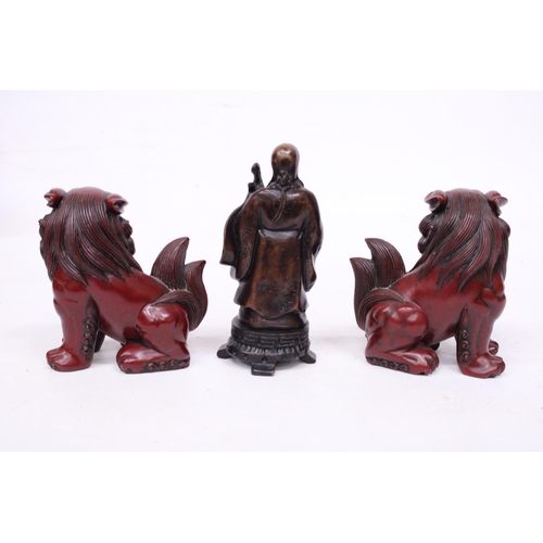 417 - A PAIR OF CHINESE FOO DOGS AND A CHINESE WISEMAN