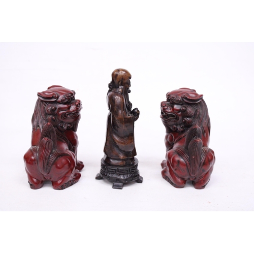 417 - A PAIR OF CHINESE FOO DOGS AND A CHINESE WISEMAN