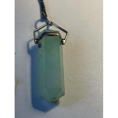 573 - A JADE CRYSTAL PENDANT ON A 925 SILVER CHAIN