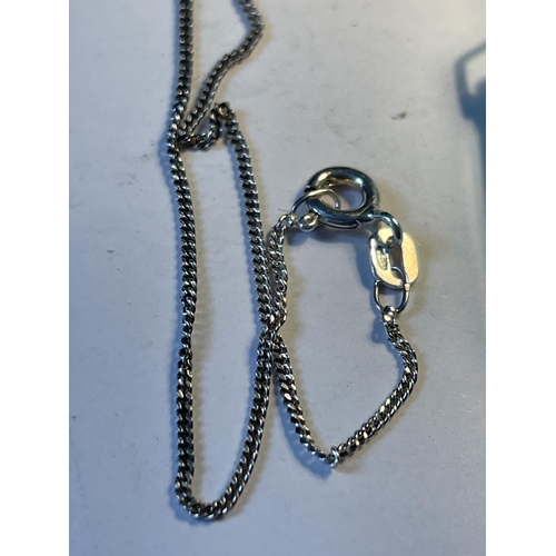 573 - A JADE CRYSTAL PENDANT ON A 925 SILVER CHAIN