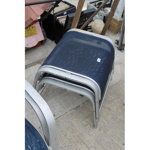 1984 - TWEO METAL STACKING GARDEN CHAIRS AND TWO FOOT STOOLS