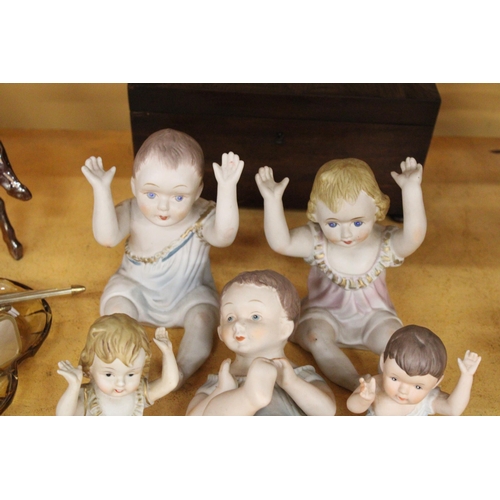 282 - THREE LARGE AND FOUR SMALL ANTIQUE PORCELAIN, BISQUE DOLLS