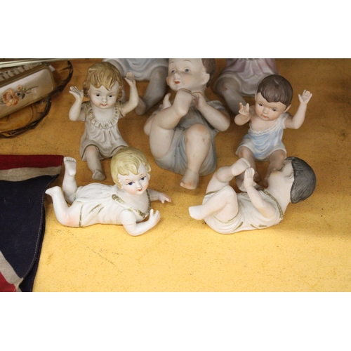 282 - THREE LARGE AND FOUR SMALL ANTIQUE PORCELAIN, BISQUE DOLLS