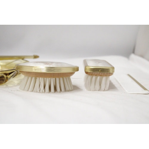 285 - A VINTAGE DRESSING TABLE BRUSH TO INCLUDE, GLAS TRAY, TWO BRUSHES, A MIRROR AND COMB, WITH EMBROIDER... 