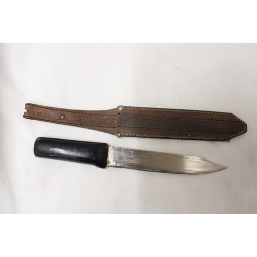 288 - AN OLD KNIFE IN LEATHER SHEATH