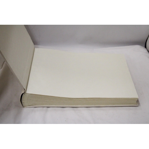 299 - A LARGE PHOTOGRAPH ALBUM WITH AN EMBROIDERED SILK COVER