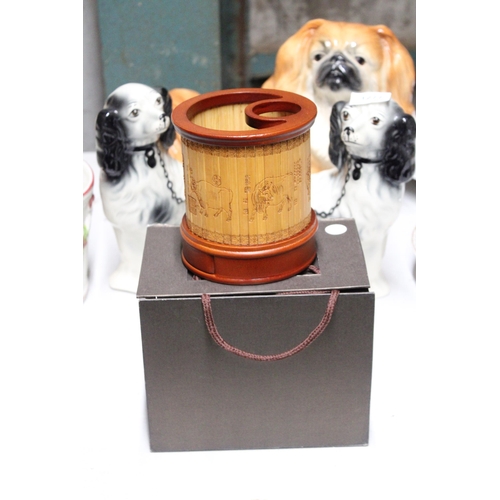 1276 - AN ORIENTAL BAMBOO PEN HOLDER WITH COW IMAGES TO THE OUTSIDE