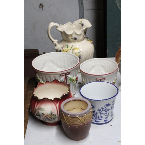 1278 - A LARGE VINTAGE FLORAL WASH JUG PLUS FIVE PLANTERS OF VARYING SIZES