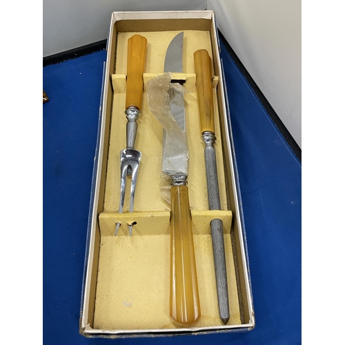 19 - TWO VINTAGE ITEMS TO INCLUDE BOXED CARVING SET AND A BAR CONTAINING NOVELTY COCKTAIL STICKS