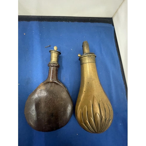 34 - TWO VINTAGE POWDER FLASKS, ONE LEATHER AND ONE BRASS