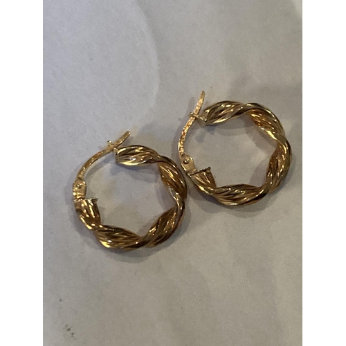 512 - A PAIR OF 9 CARAT GOLD TWISTED HOOP EARRINGS GROSS WEIGHT 1.21 GRAMS