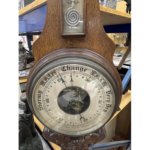 80 - A VINTAGE CARVED BAROMETER WITH A CASED THERMOMETER