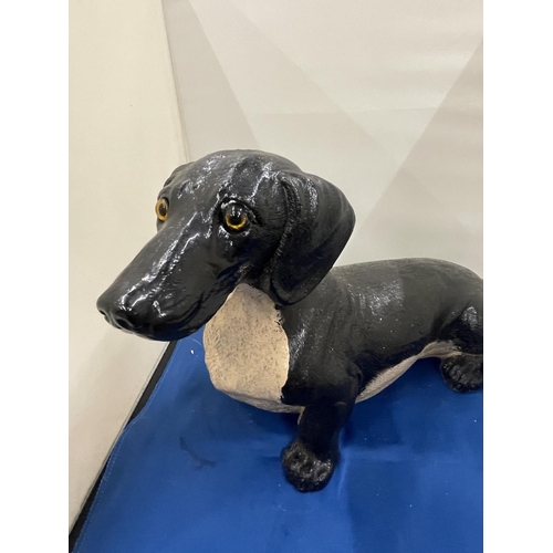 85A - A LARGE FIGURE OF A DACHSHUND APPROXIMATELY 36CM IN LENGTH